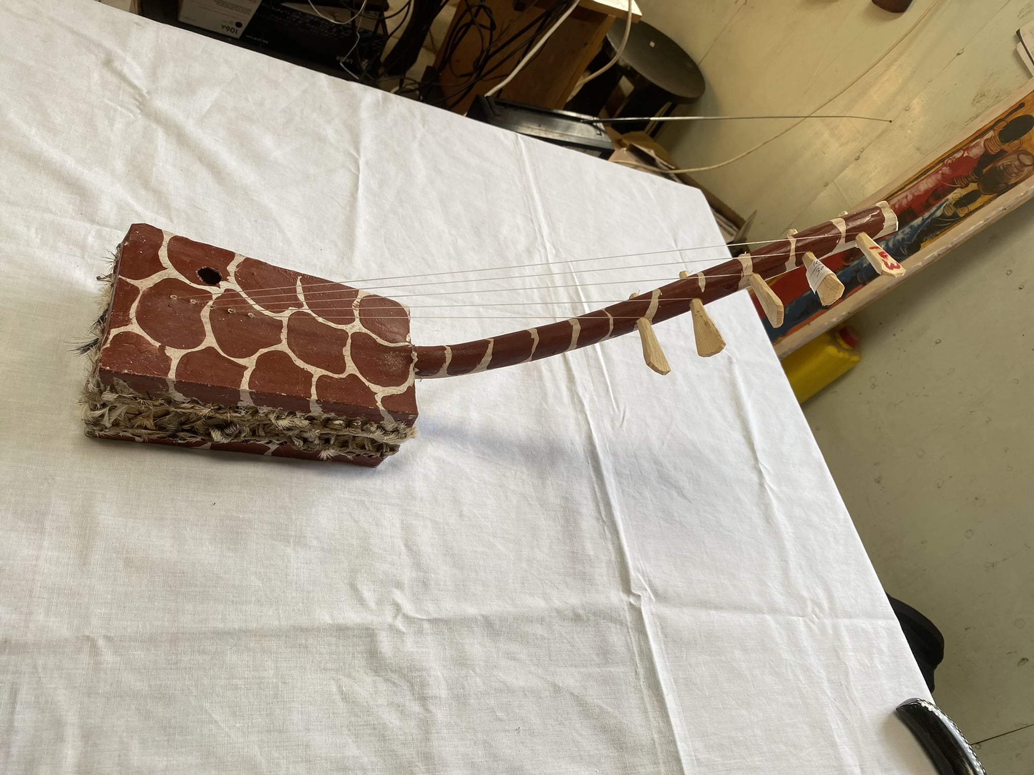 wooden 5 string musical instrument with giraffe pattern 2