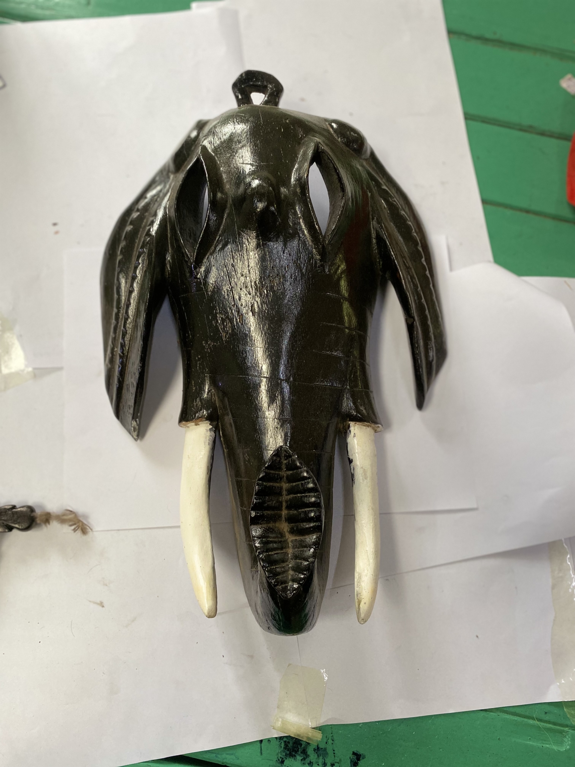 wooden black animal mask with tasks wall art