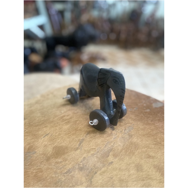 wooden elephant on wheels