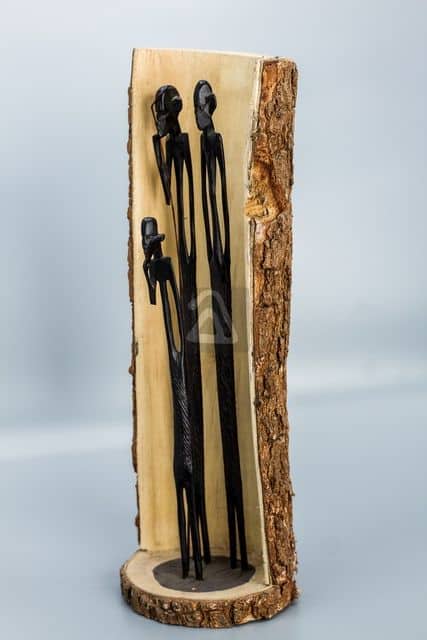 wooden family carved into tree trunk 2
