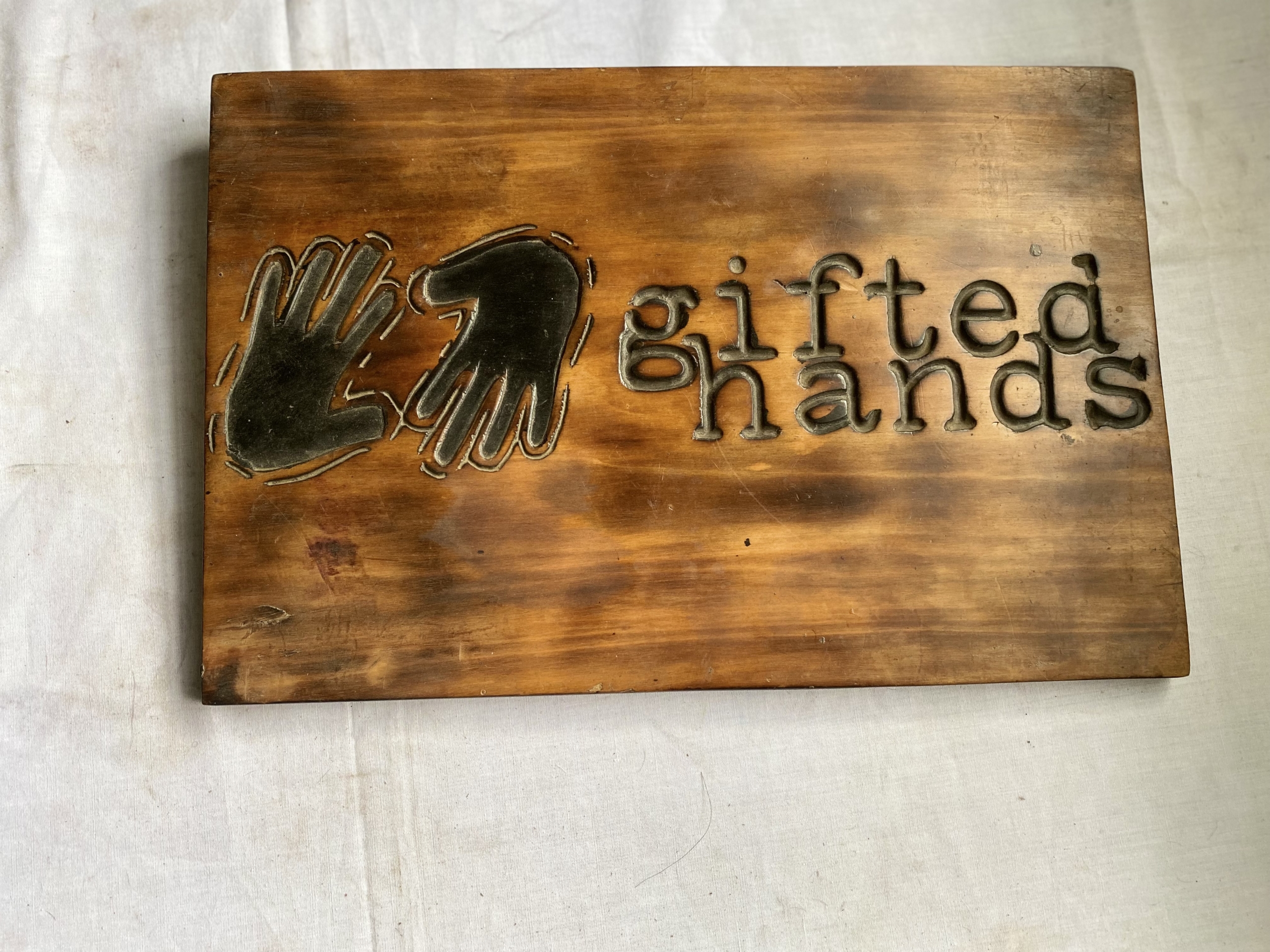wooden gifted hands wall sign