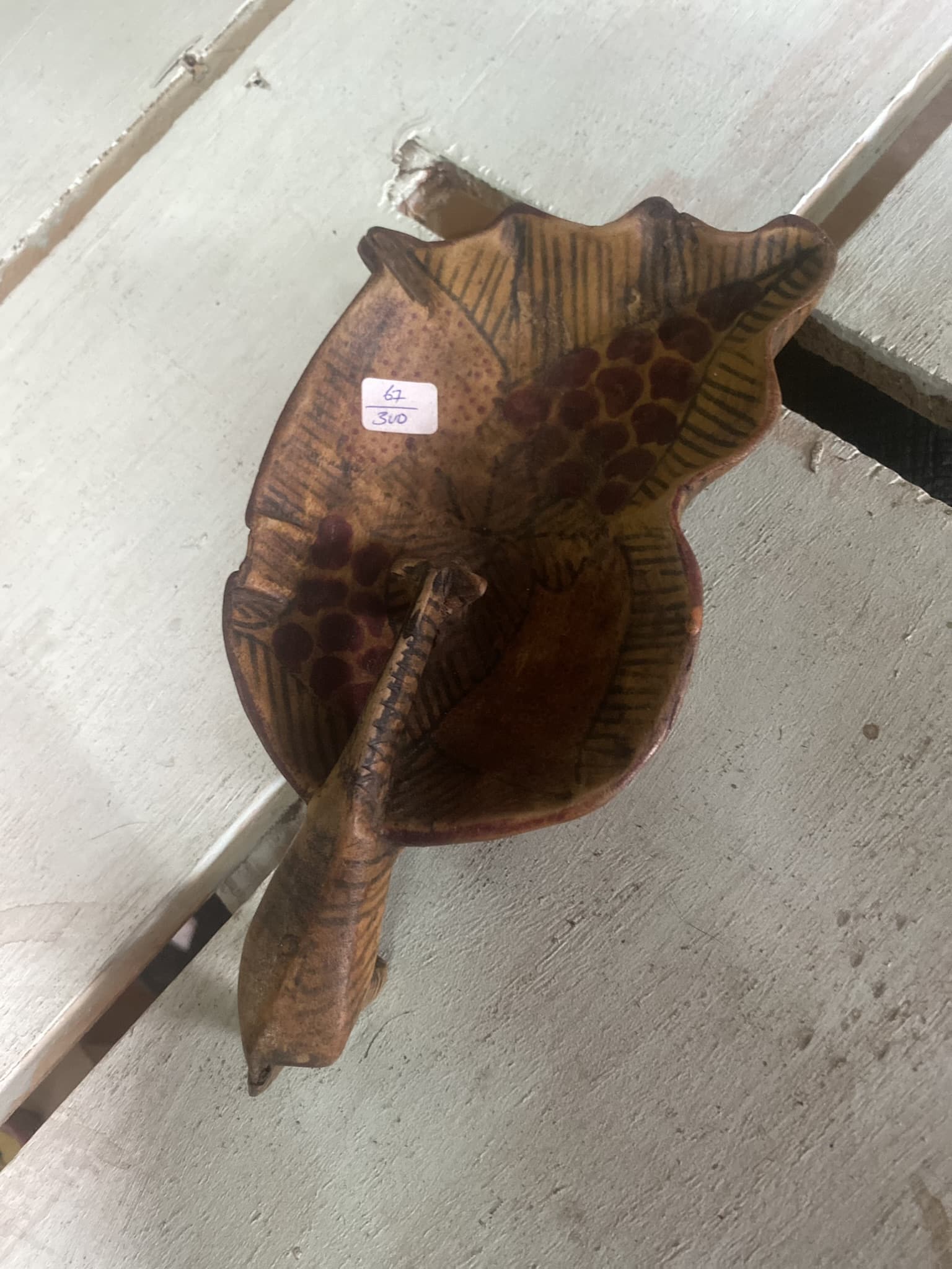 wooden giraffe drinking from bowl 2