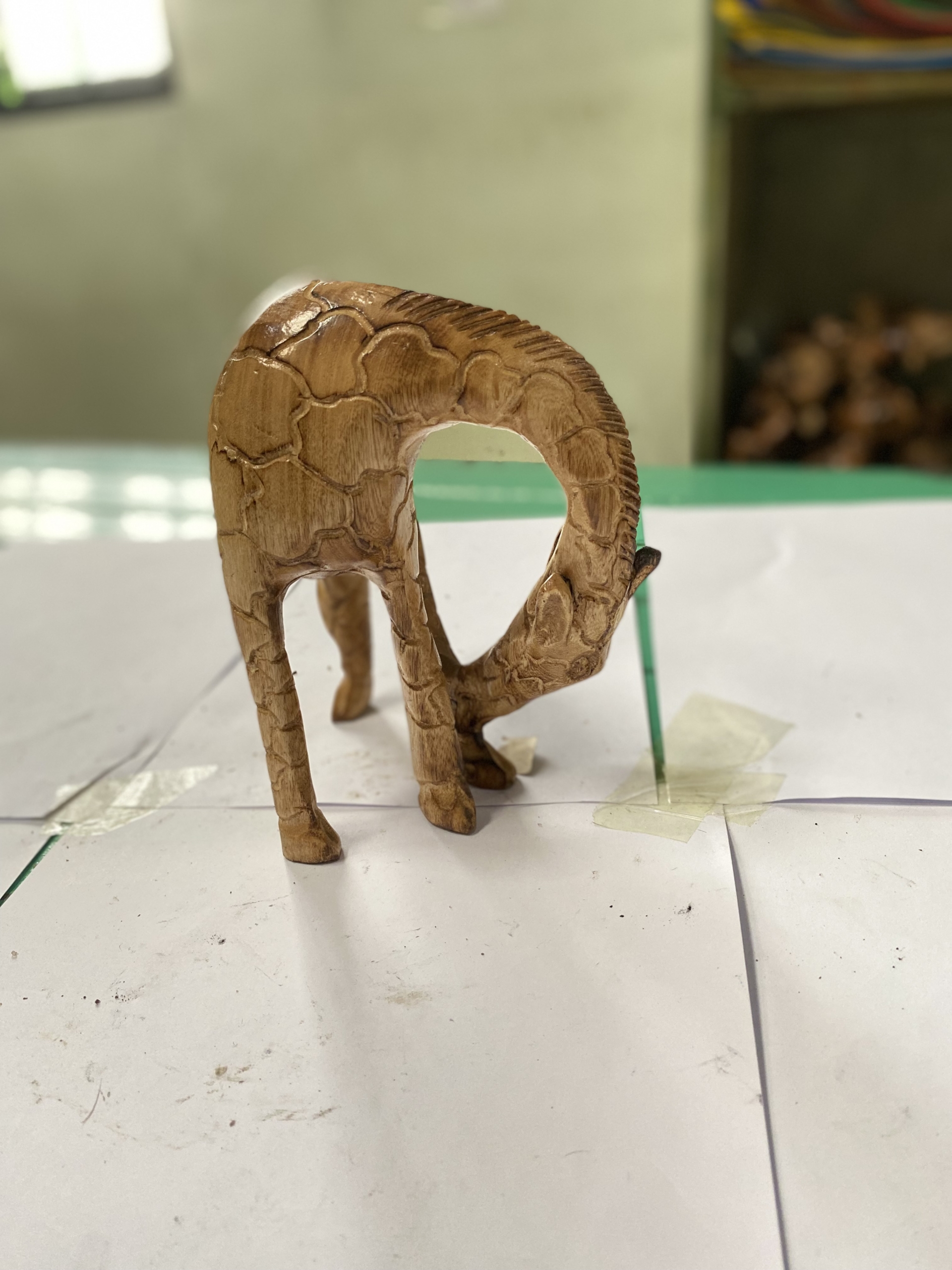 wooden giraffe eating