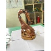 wooden giraffe licking leg