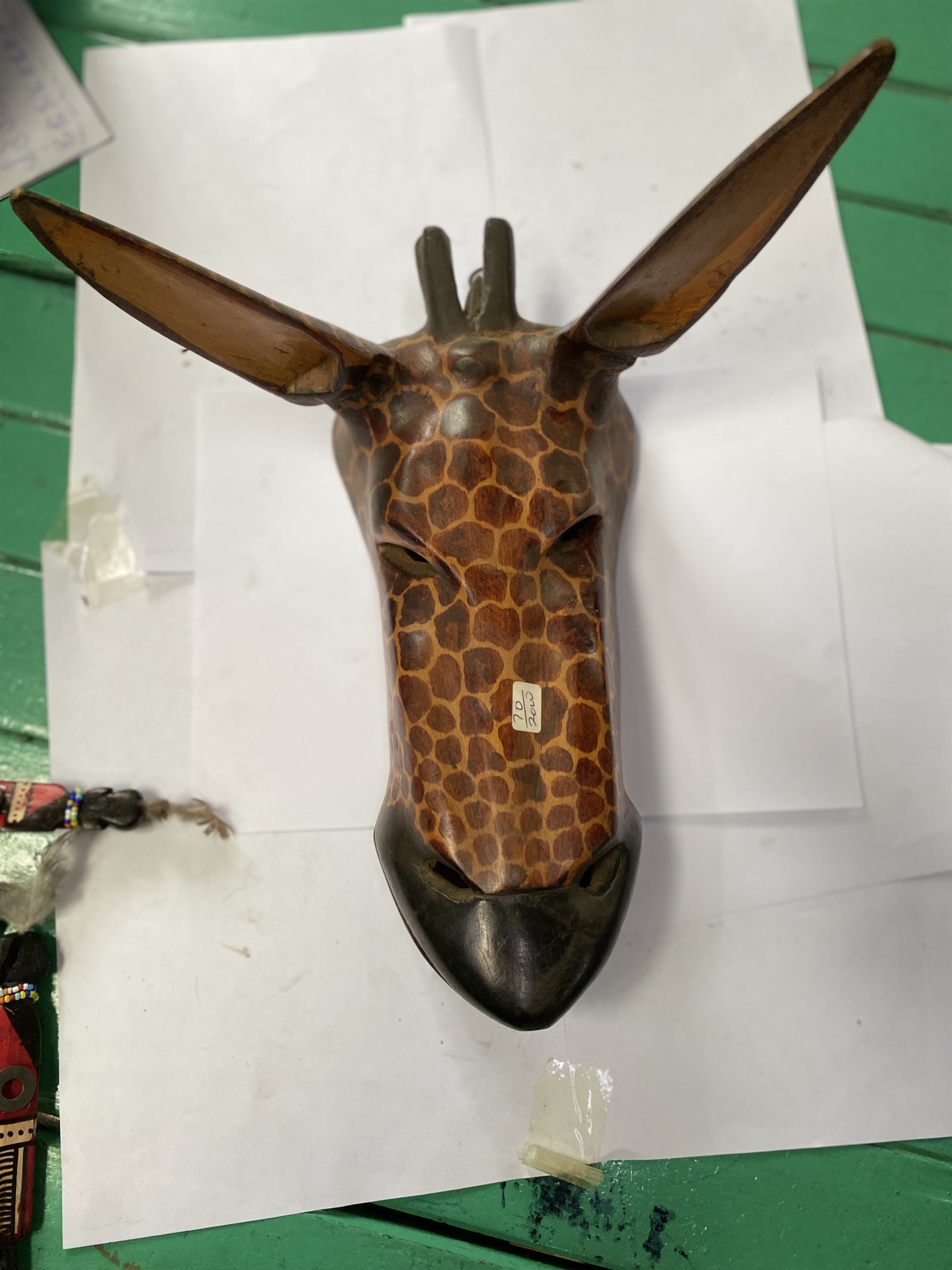 wooden giraffe mask wall art