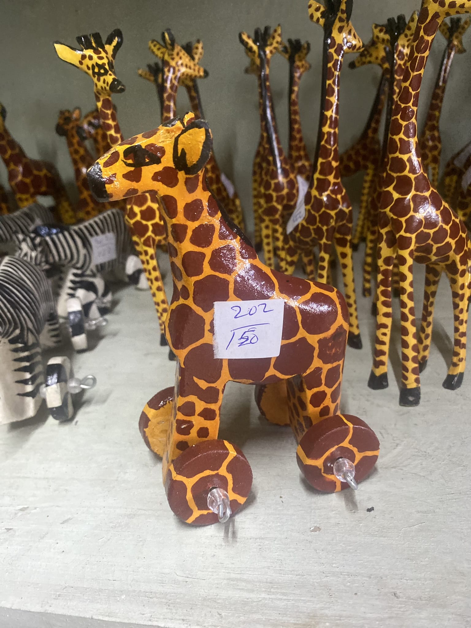 wooden giraffe on wheels 3