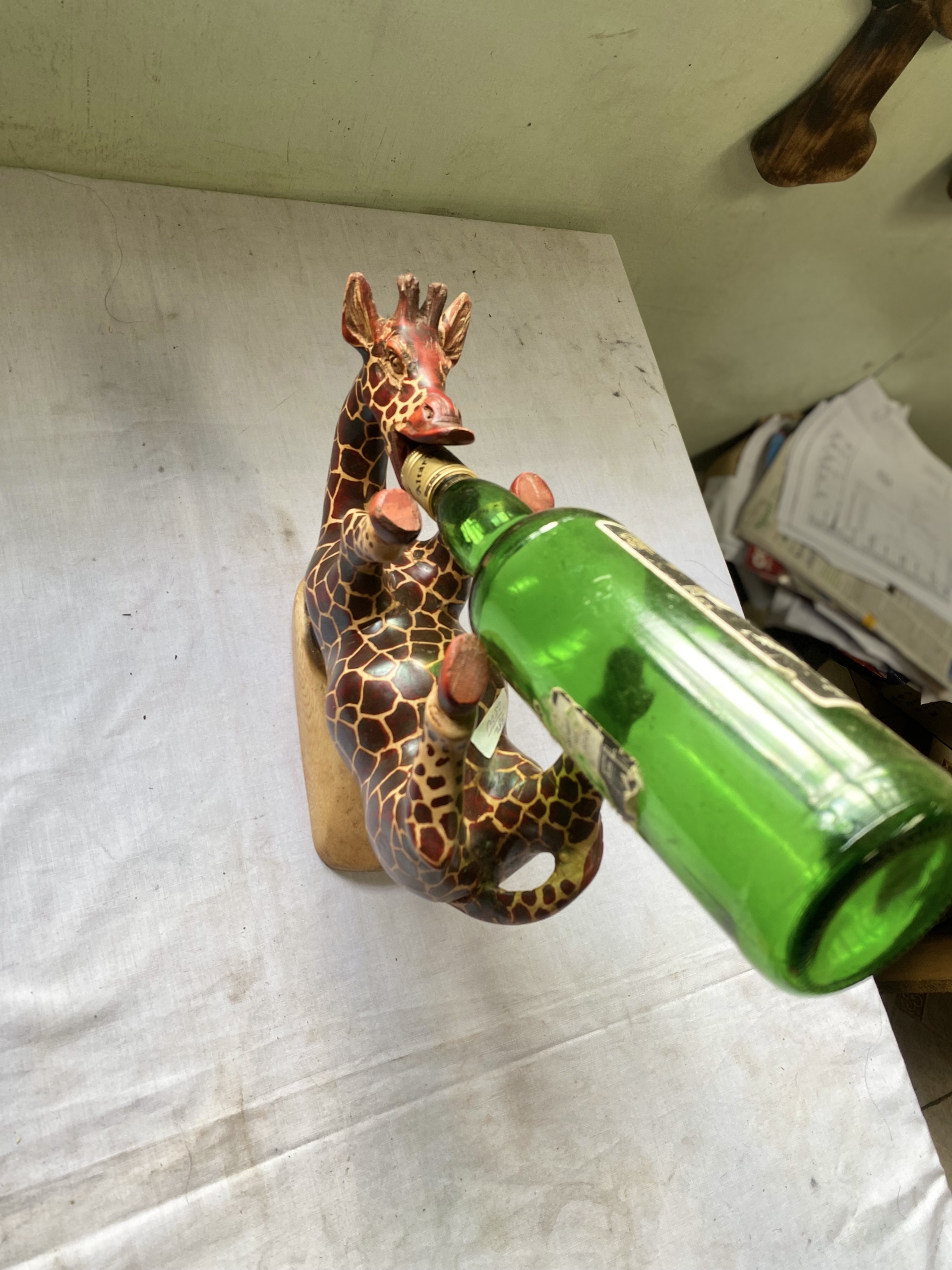 wooden giraffe shaped whiskey bottle holder
