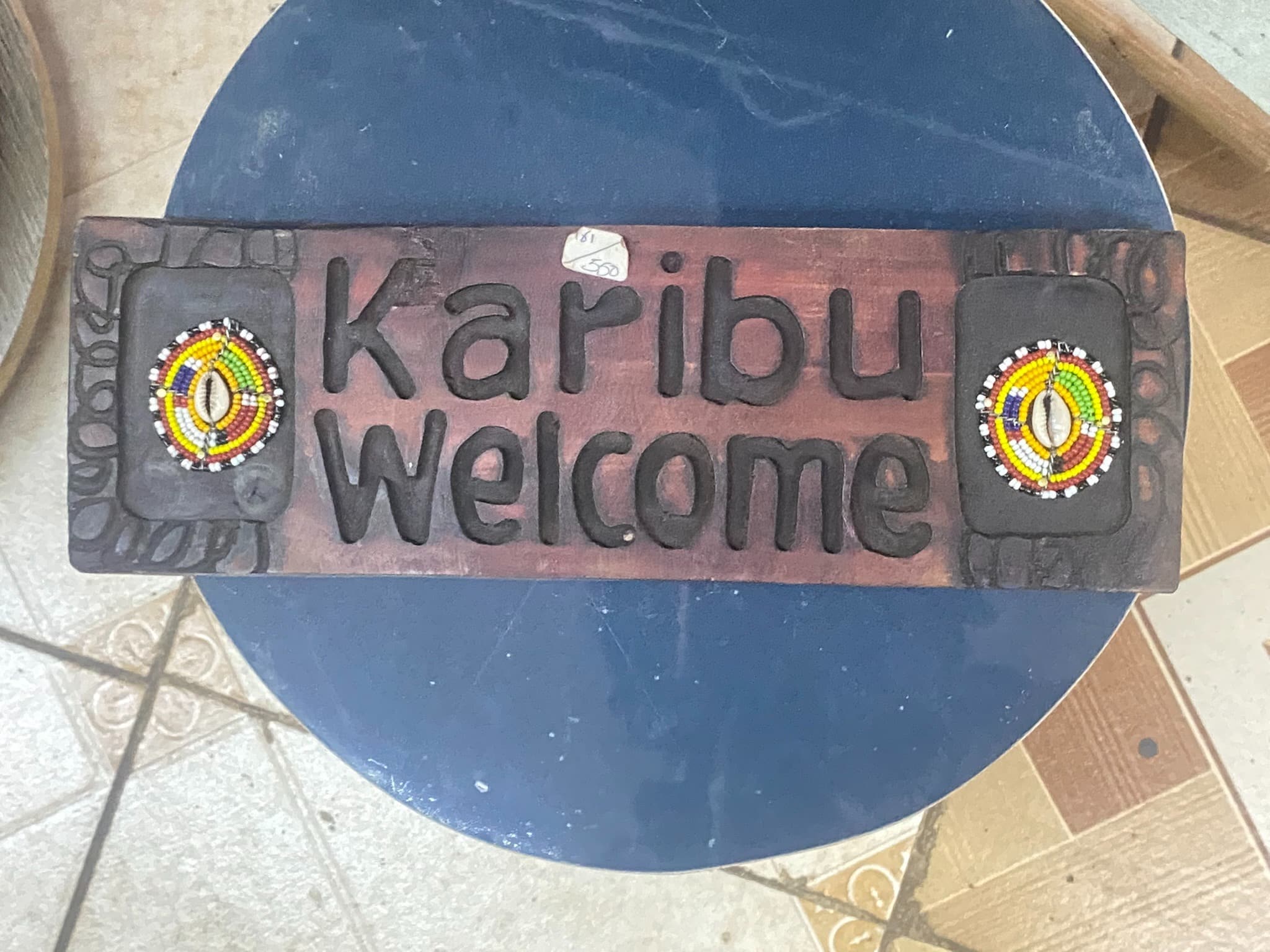 wooden karibu welcome wall sign