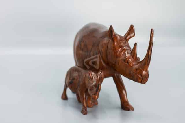 wooden rhino and calf